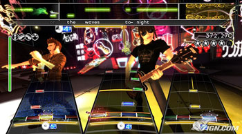 Each instrument is represented by a different interface: bass guitar (left), drums (middle), lead guitar (right), vocals (top). The Band Meter (green meter on left) measures the performance of each band member, while the Energy Meter (gold meter beneath each interface) tracks each player's Overdrive.